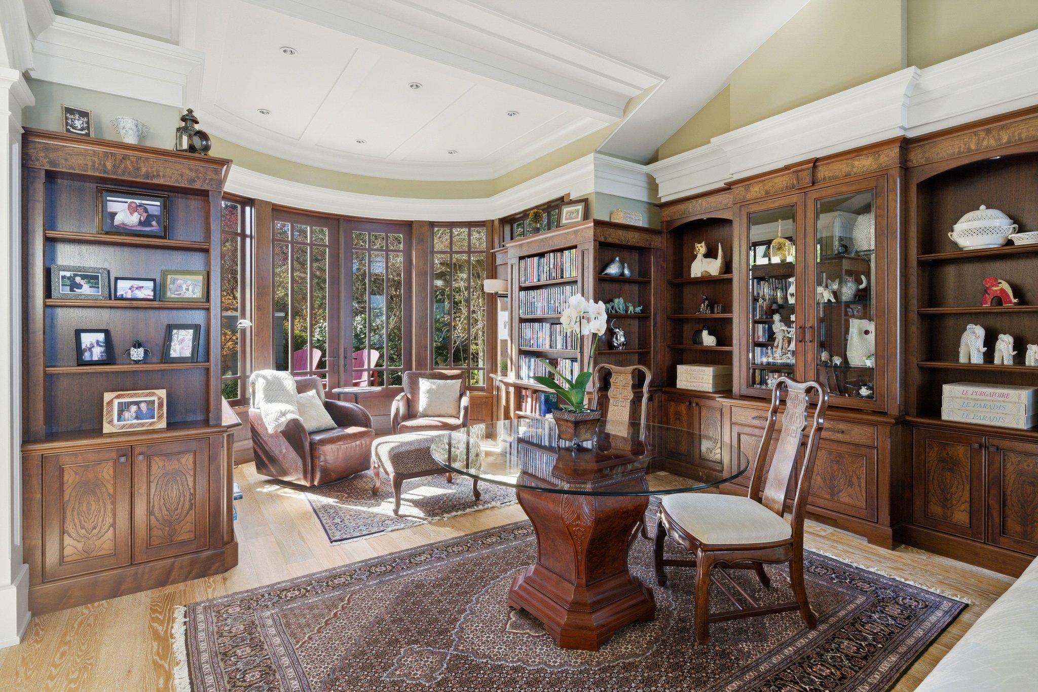 Library with custom olive burl millwork and bay windows